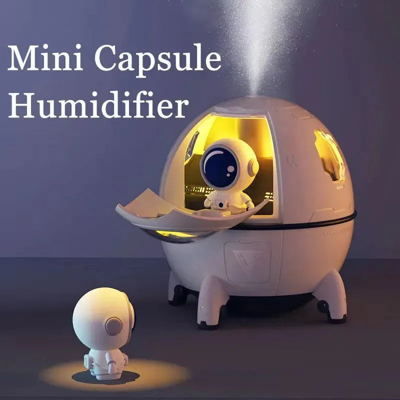Astronaut-shaped portable USB humidifier with colourful LED light on a desk