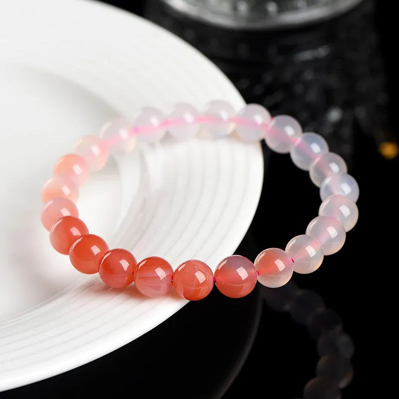 Yanyuan agate bracelet with gradient colours showing beads in a geometric style on a wrist.