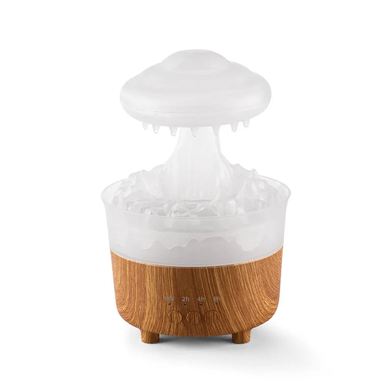 Wood grain white rain cloud shaped humidifier diffuser with LED night light on a table.