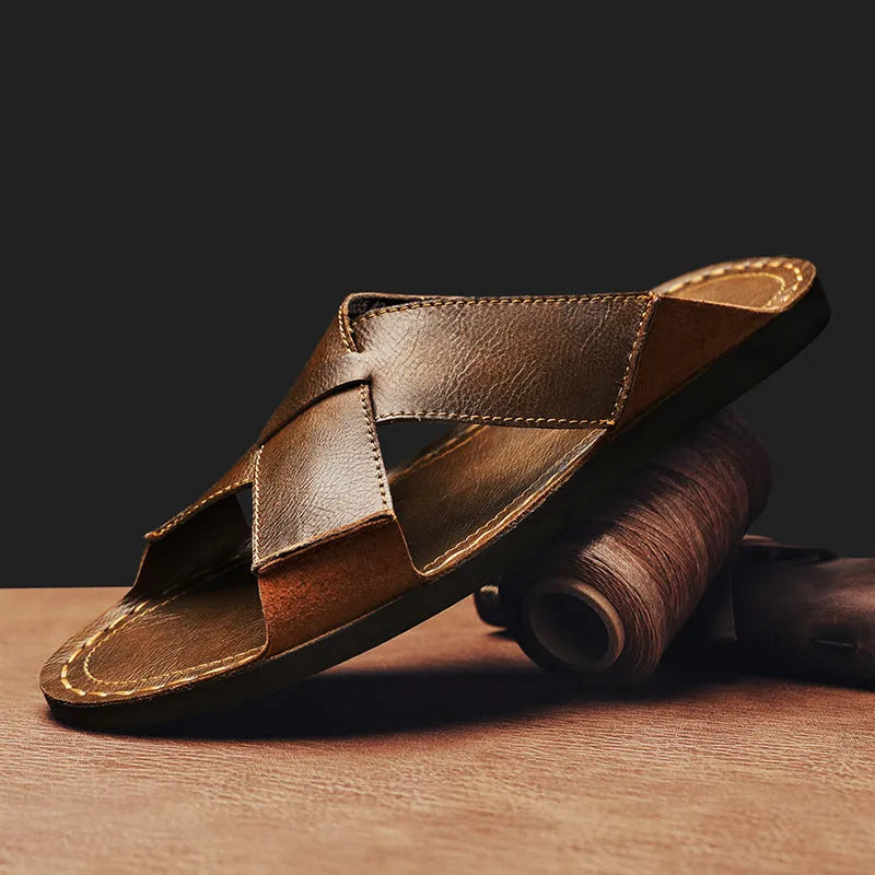 Men's black genuine pigskin leather slip-on sandals with a frosted finish and rubber sole.