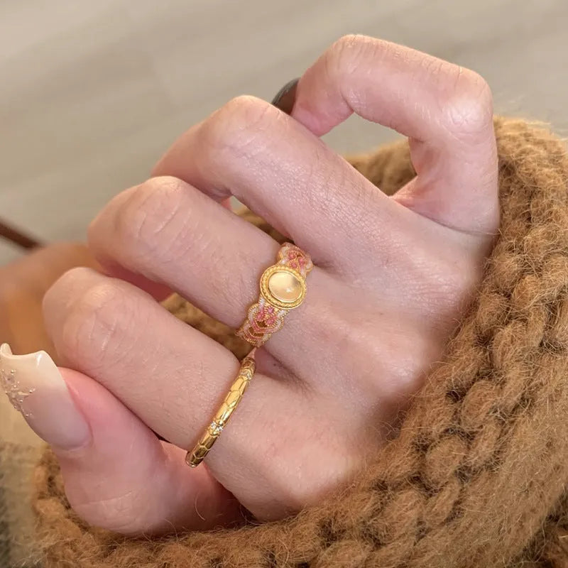 Pink crystal enamel geometric open mouth ring for women on gold-plated copper band.