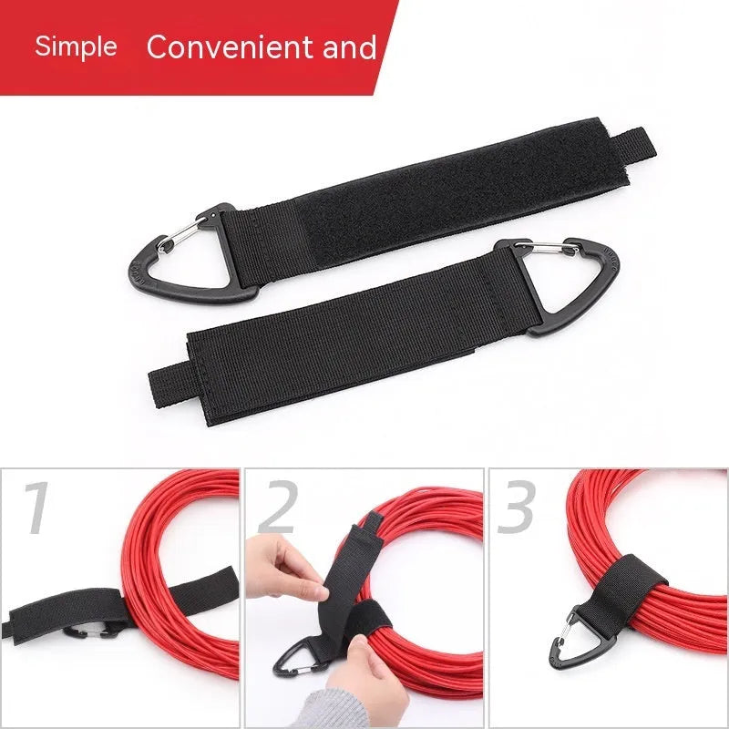 Black heavy-duty carabiner storage strap showing the climbing carabiner hook and 38mm wide blended material.
