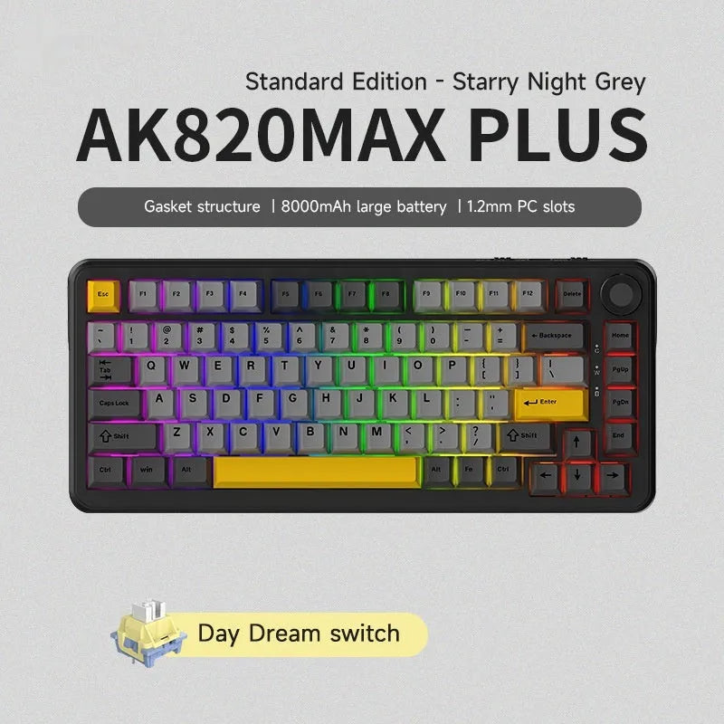 Black, grey and yellow wireless mechanical keyboard with hot-swap switches and included tools on a desk.