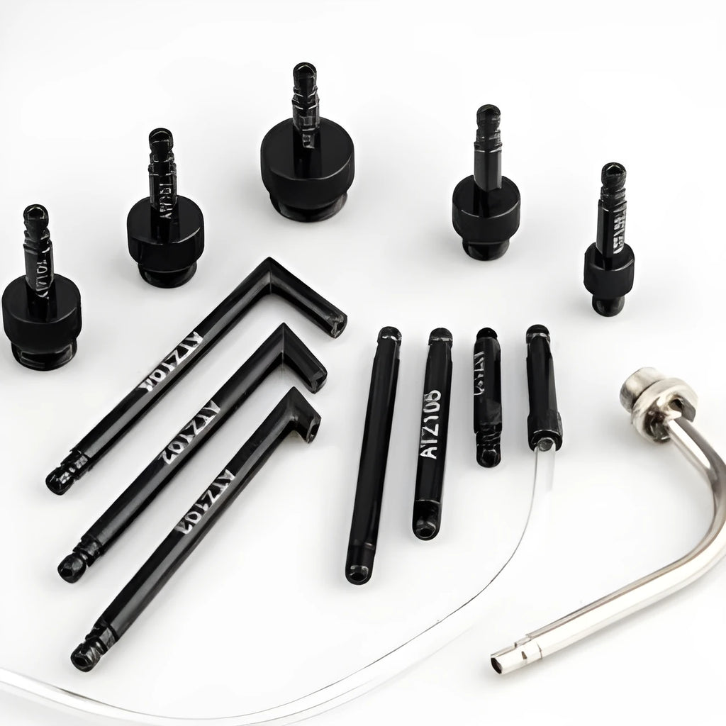 13-piece automatic transmission oil refuelling kit with injector tool and connector attachments on a bench.