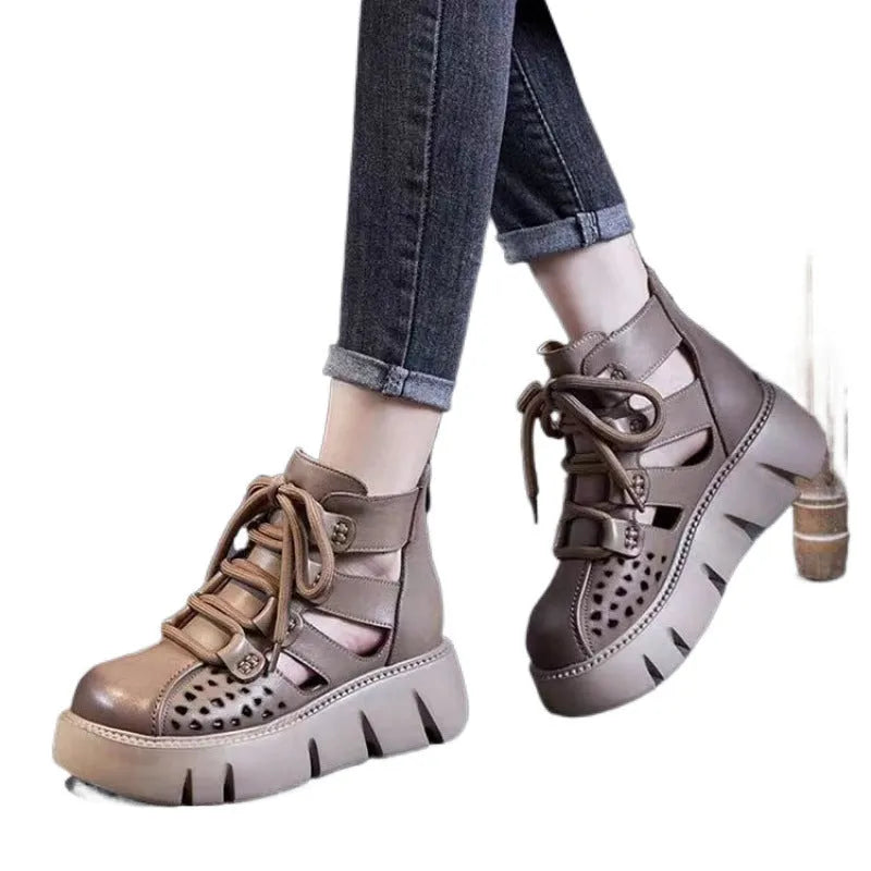 Women's black platform sandals with fish mouth toe and plush leather upper on a neutral background.