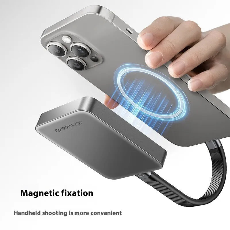 Grey magnetic mobile solid state drive with ultra-thin design next to its C to C cable and magnetic suction ring.