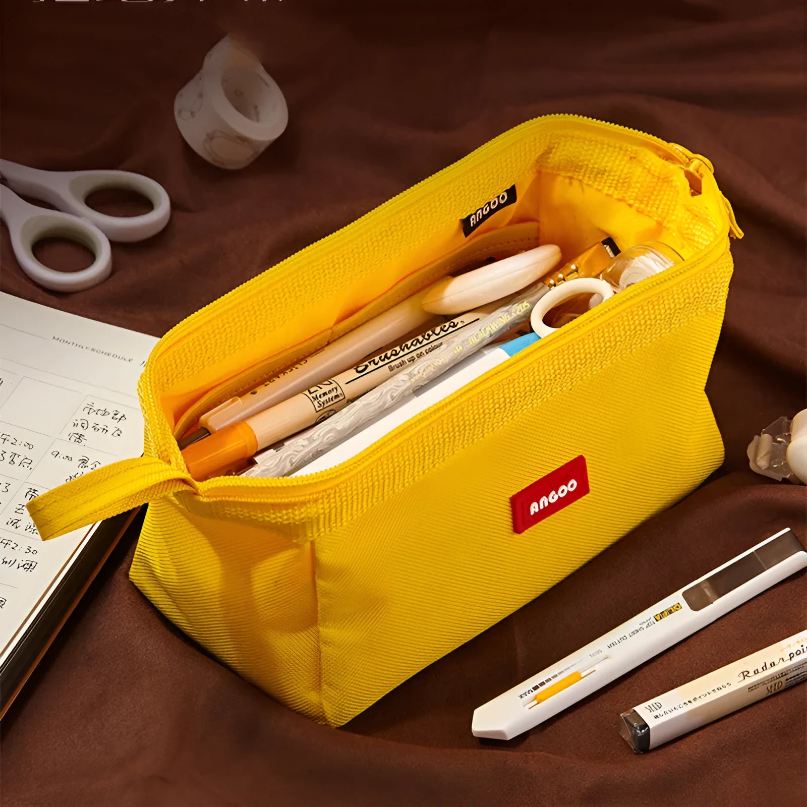 Large-capacity Oxford cloth pencil case with double zipper in yellow, with interior storage visible