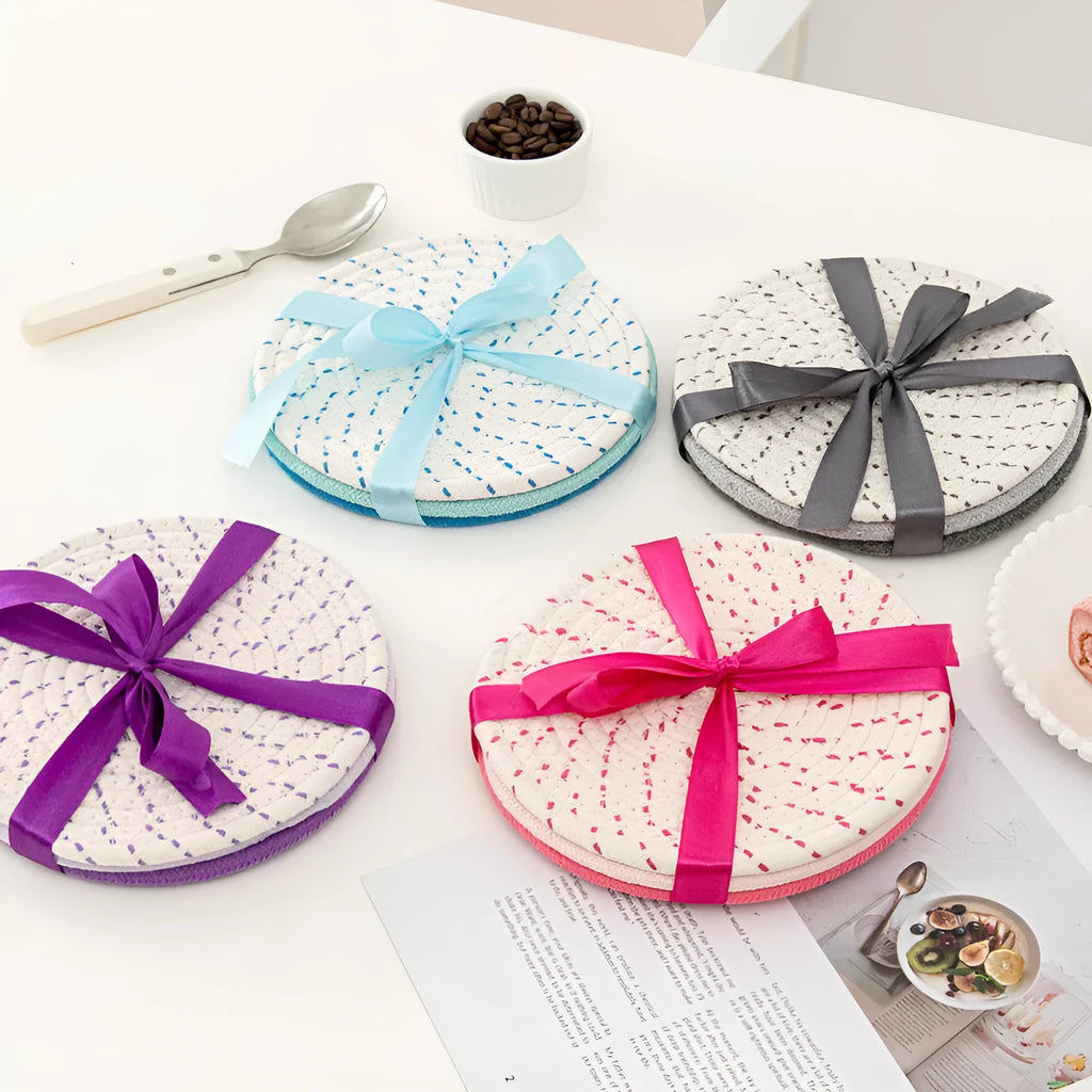 Three round cotton cord coasters in blue colour showing 18cm diameter measurement