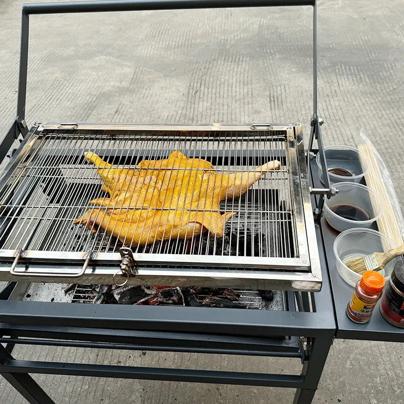 Foldable charcoal barbecue stove with large grill shown in courtyard setting