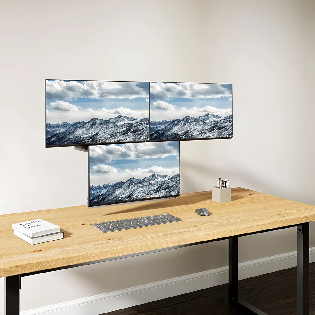 Black three-arm gas spring monitor mounting bracket for 13-27 inch computer screens.
