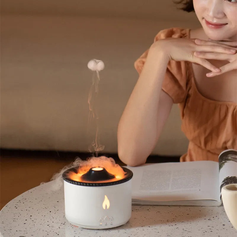 White round humidifier producing a two-colour blue and white volcanic spray ring of mist.