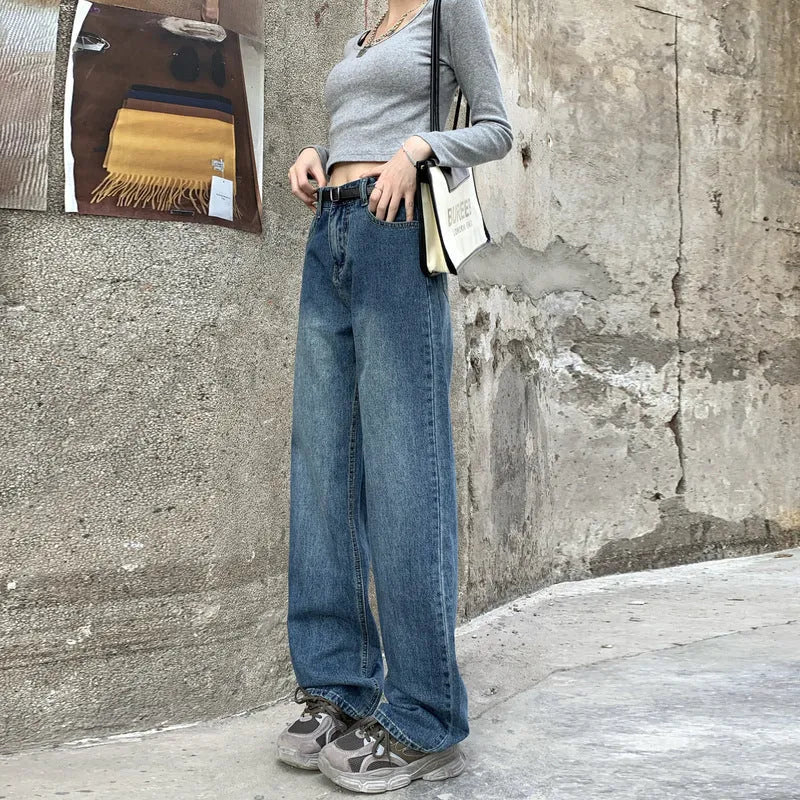 Women's retro blue straight leg jeans with a high waist, shown on a hanger.