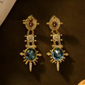 Gold geometric round stud earrings with diamond treatment finish on alloy metal