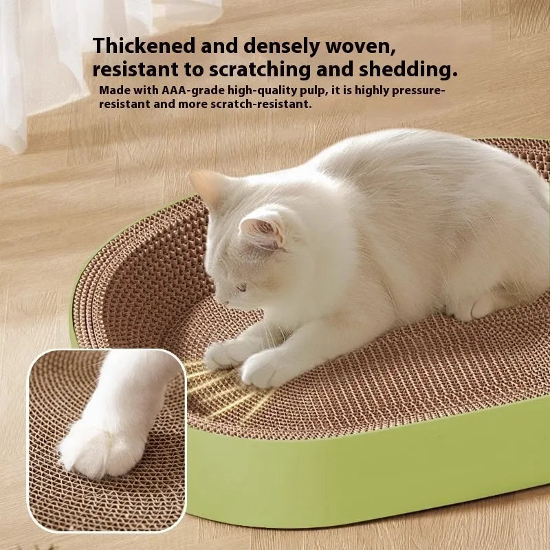 Green oval corrugated paper cat scratch board and nest bed, 55cm diameter.