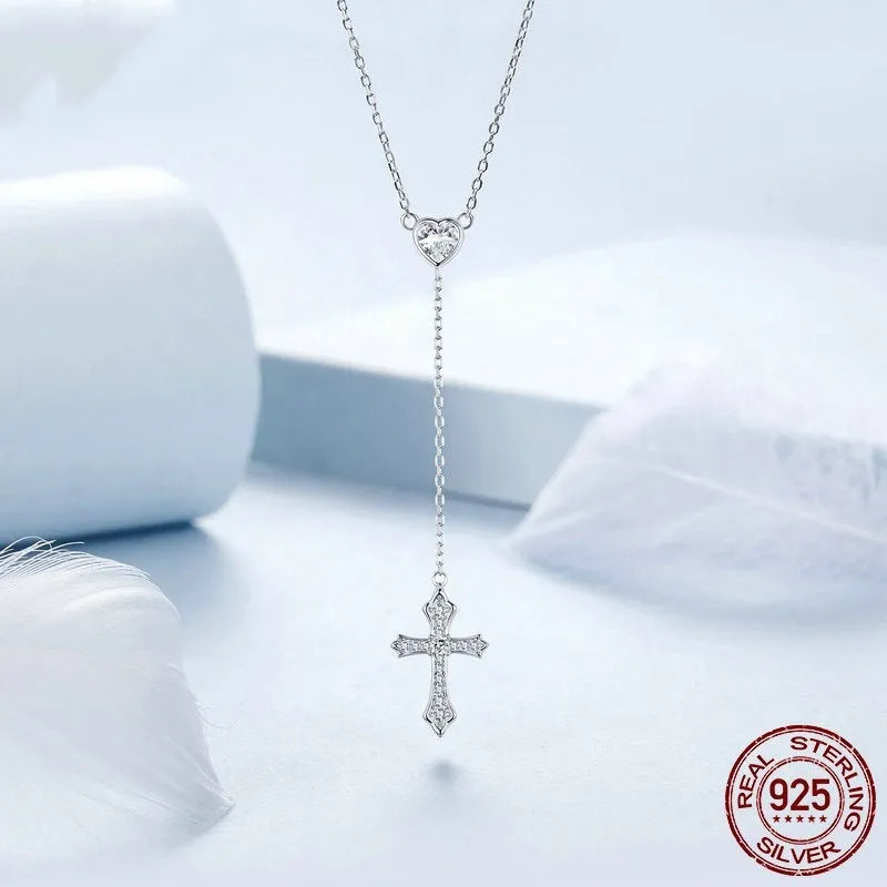 Silver necklace with a small cross pendant on an O-ring chain, shown in colour BSN384.