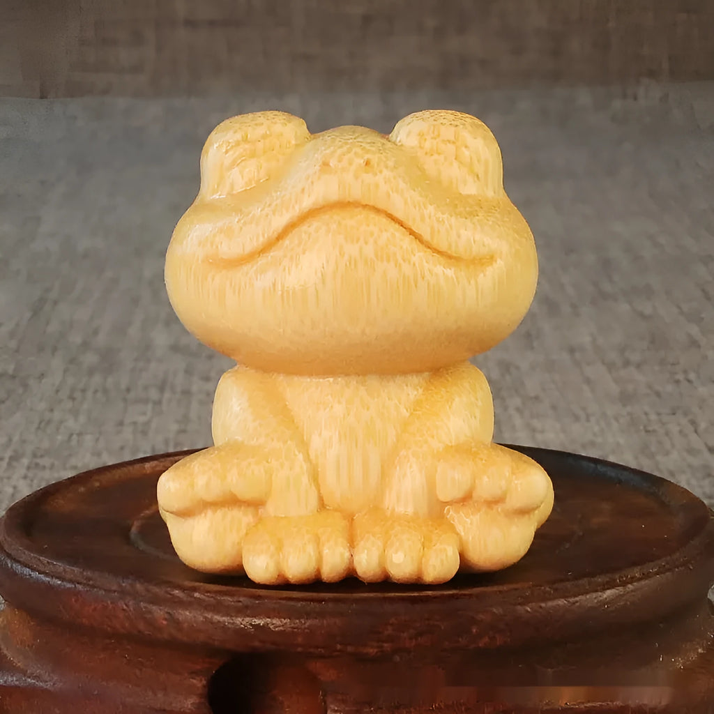 Solid bamboo smiling frog carving ornament measuring 5cm height with cartoon style design