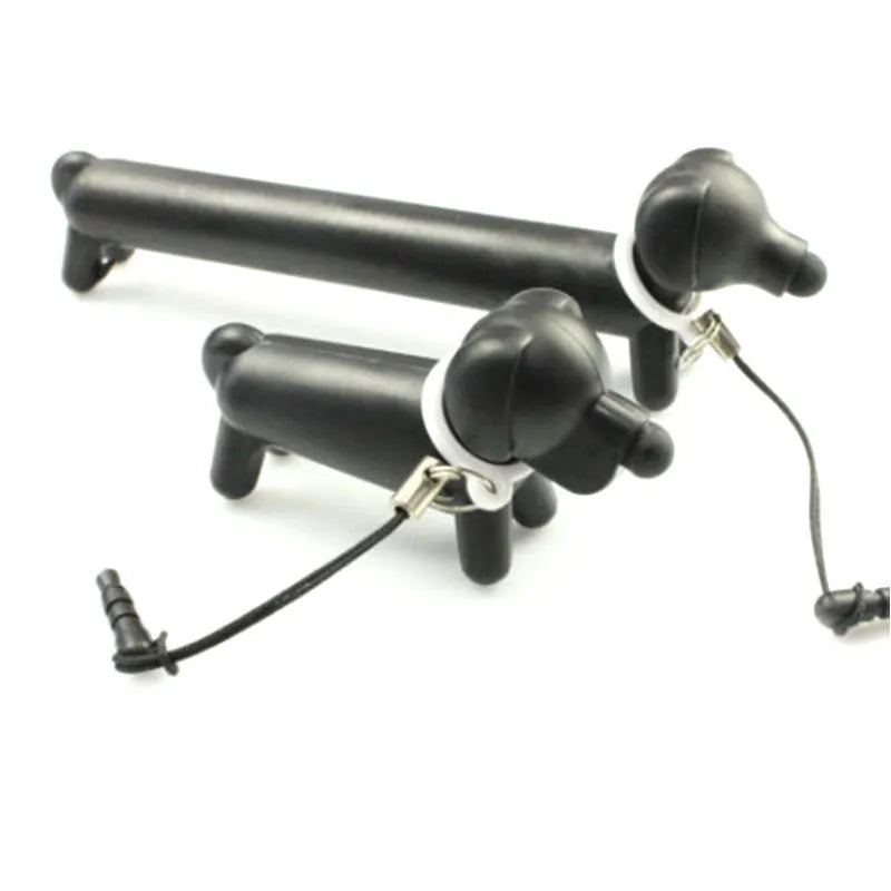 Black long puppy dog shaped touch screen stylus pen shown next to its carry socket