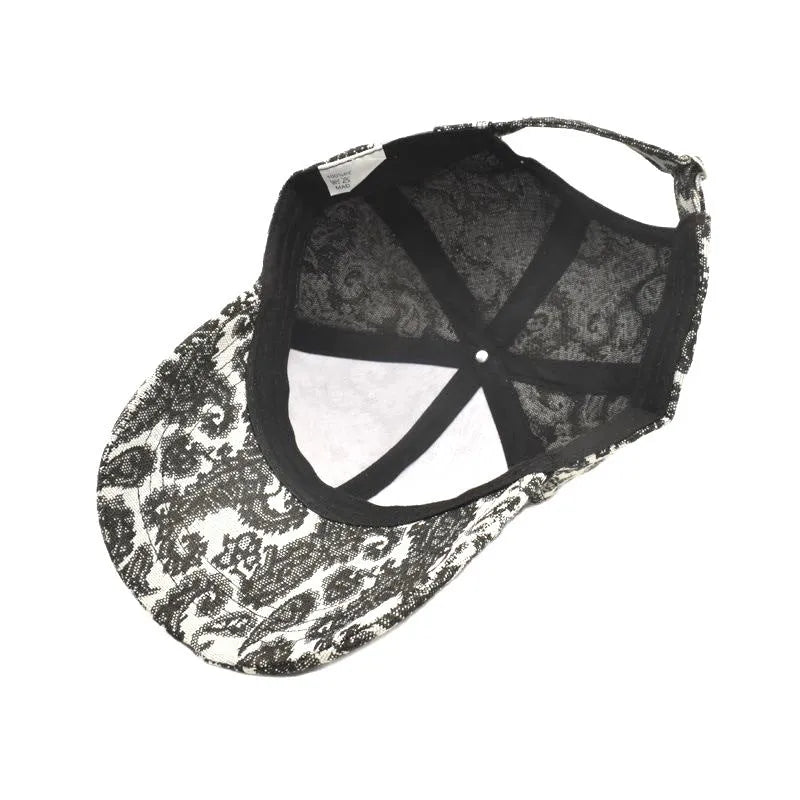 Polyester baseball cap with printed paisley pattern in blue, showing dome crown construction