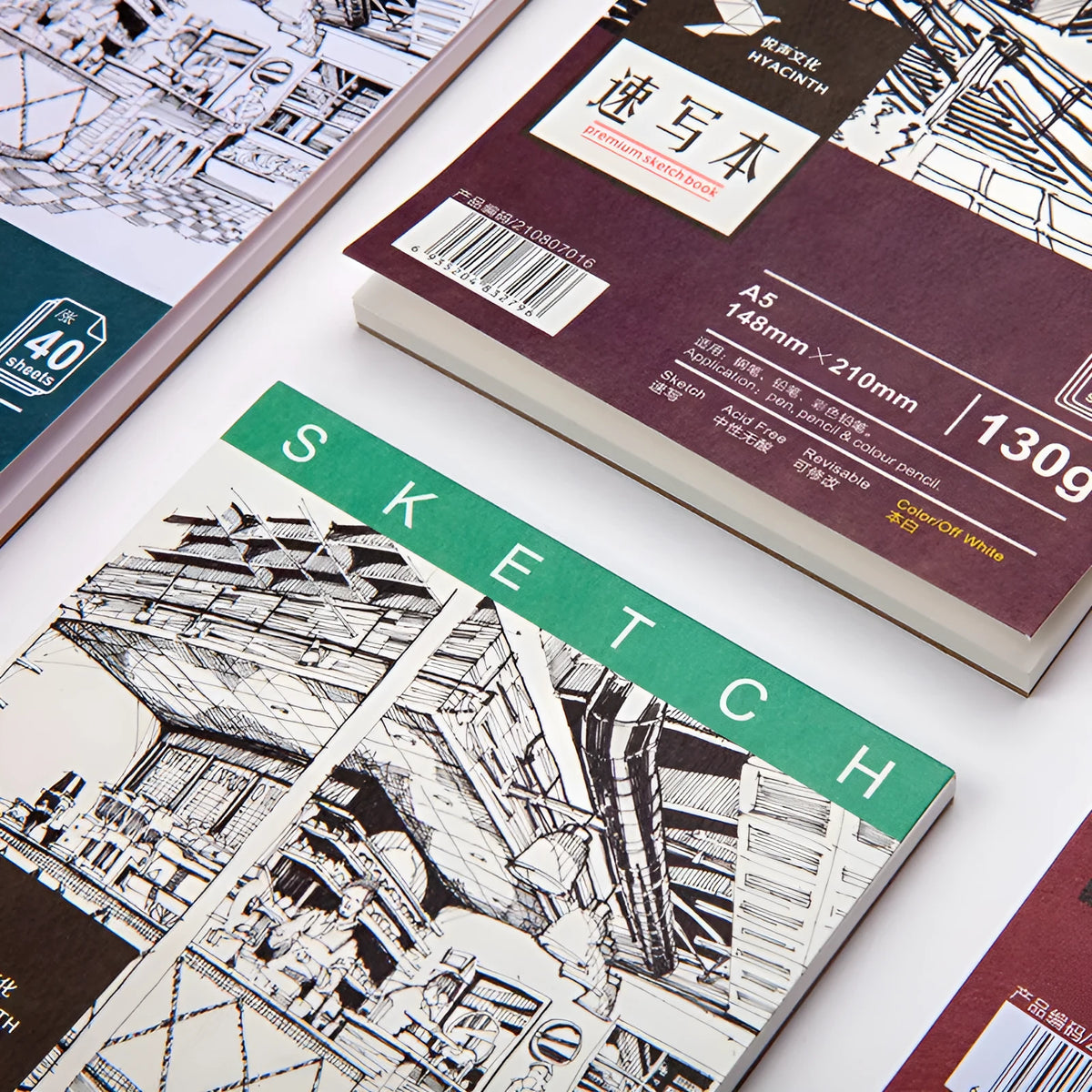 A4 format sketchbook with coil binding and open pages, showing heavy-weight drawing paper.
