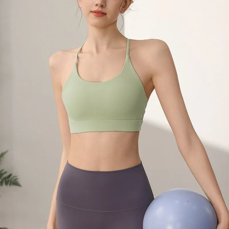 Women's high-strength nylon sports vest for running and yoga in black colour with double-shoulder straps.