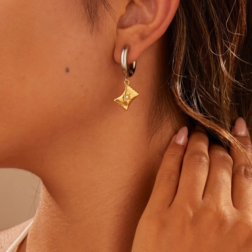Christmas tree heart earrings in stainless steel with 18K gold plating showing star and geometric shapes
