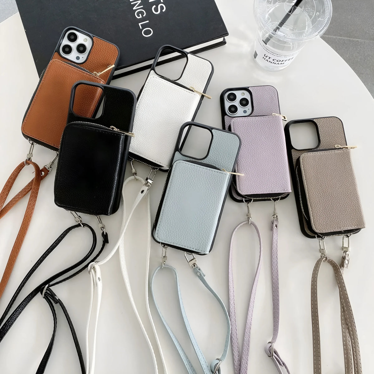 Litchi pattern textured protective case for iPhone on a table, shown in a selection of available colours.