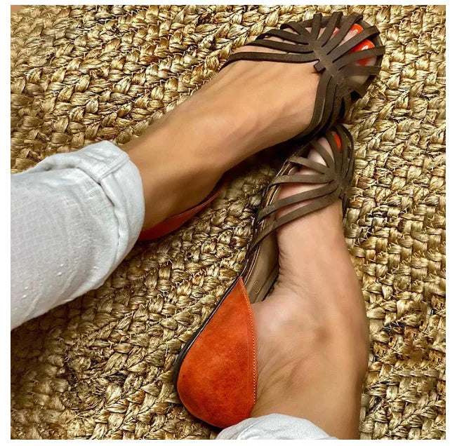 Women's flat heel leopard print sandals with a square buckle and ankle strap.