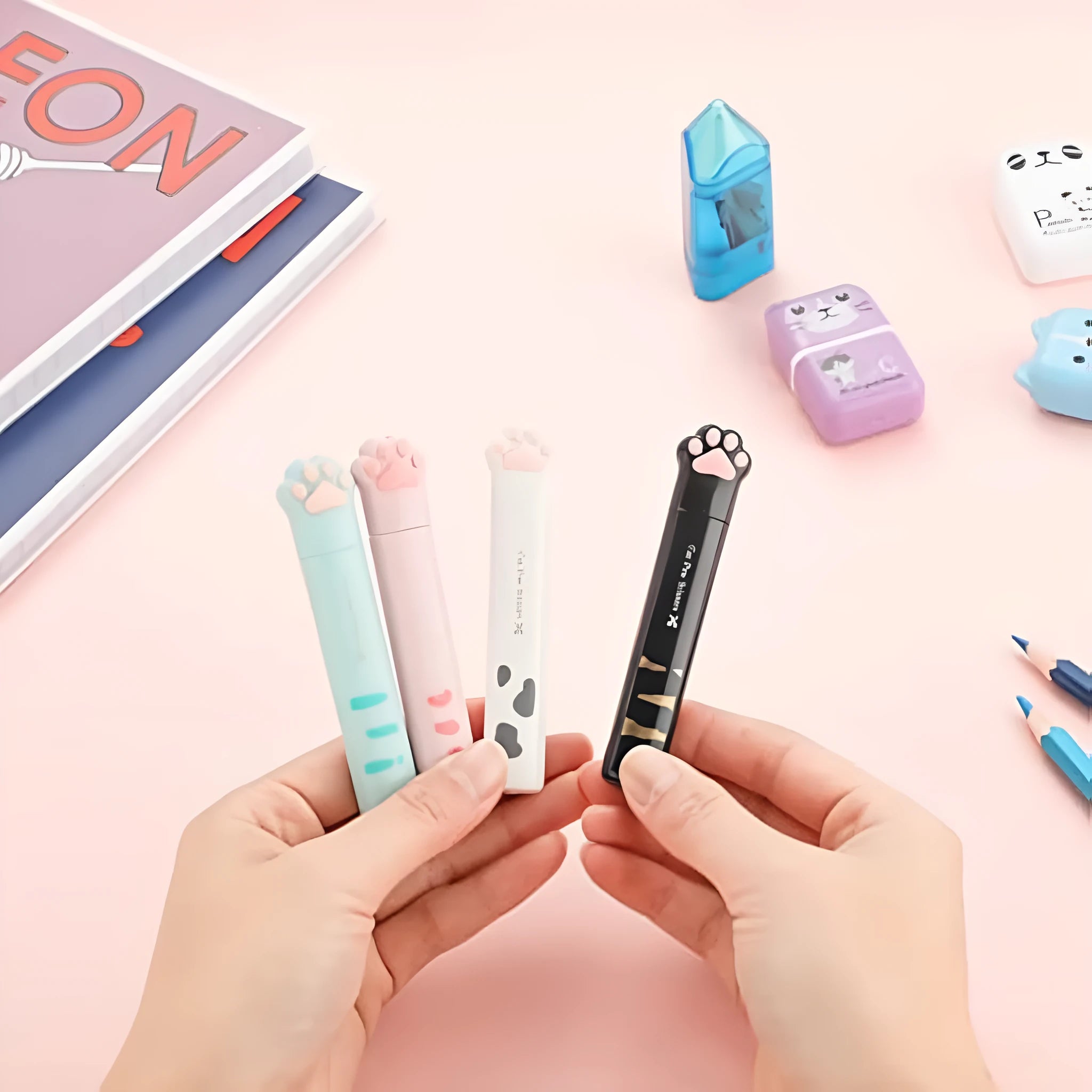 Cat paw mini folding scissors in pink, white, black, and blue colours showing closed and open positions