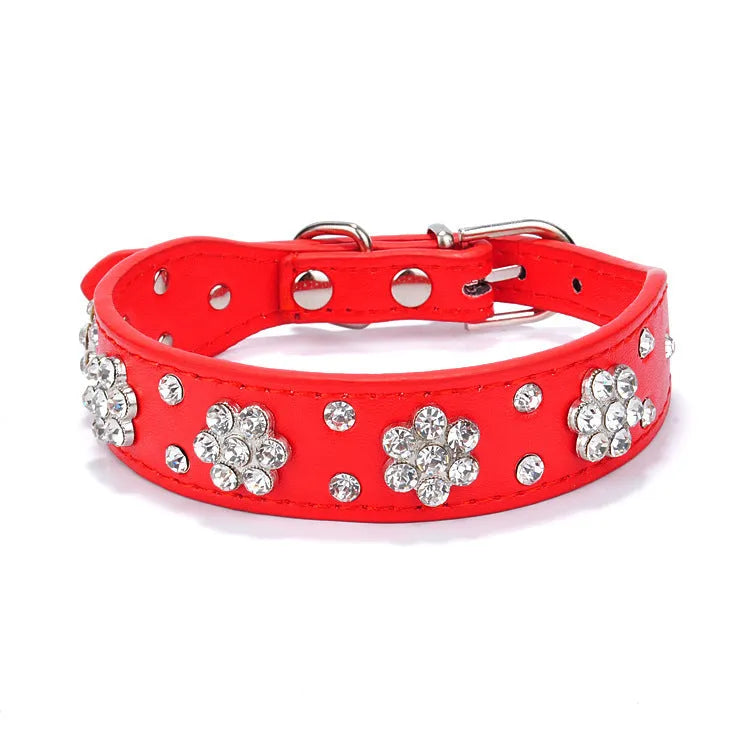 Rhinestone and studded flower pattern on a black adjustable PU leather dog collar with metal D-ring