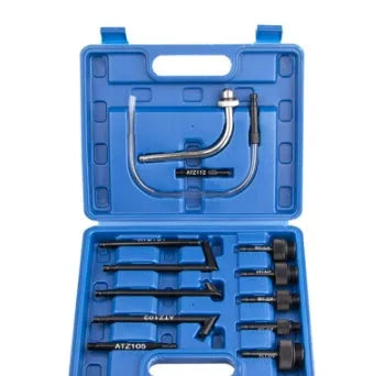 13-piece automatic transmission oil refuelling kit with injector tool and connector attachments on a bench.