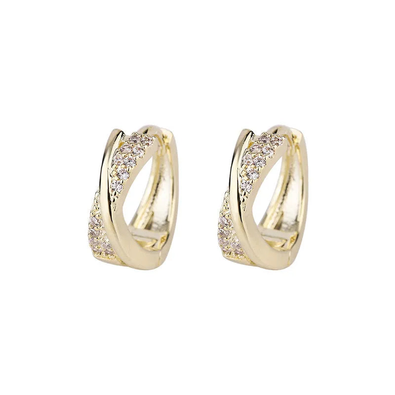 Geometric shape copper earrings with zircon accents in 14K yellow gold tone.