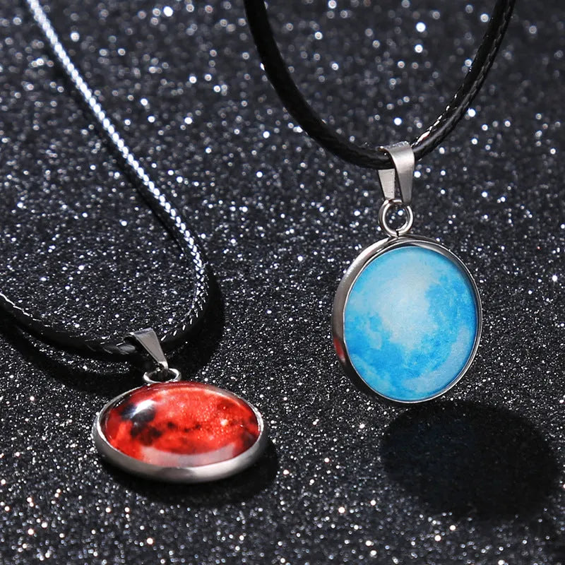 Luminous constellation glass pendant necklace with a moon and night sky design on an adjustable chain