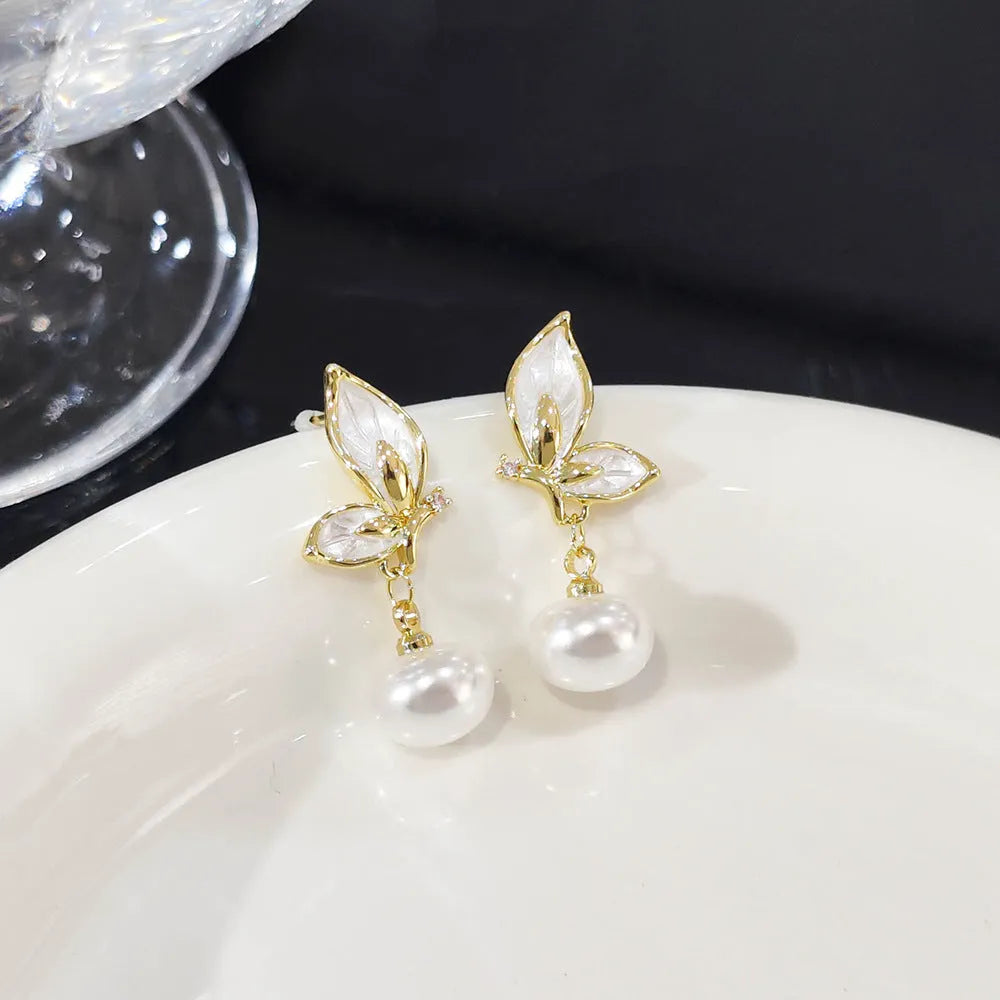 Zircon butterfly earrings for women in electroplated copper with simple geometric design