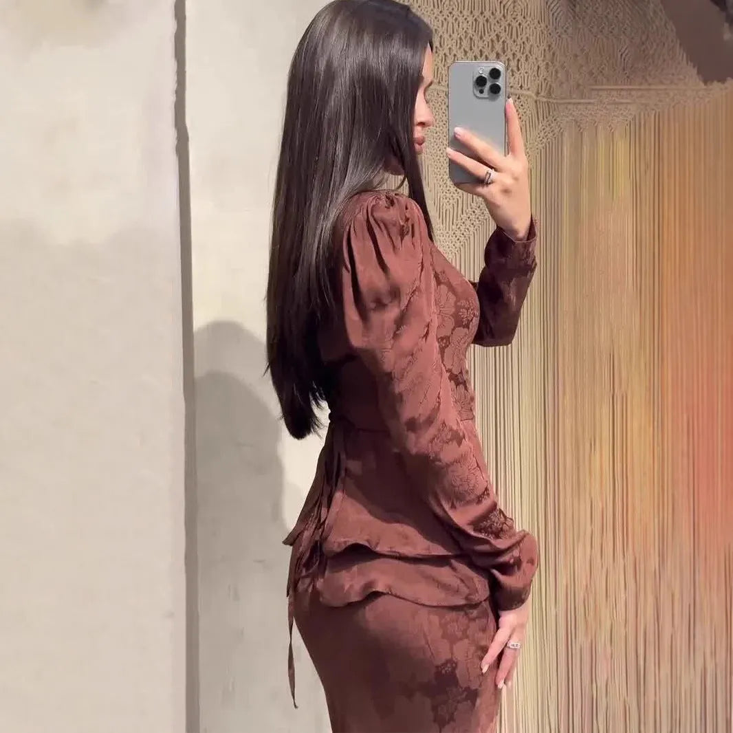 Dark brown artistic retro long dress with plant pattern, long sleeves, and a fake two piece design.