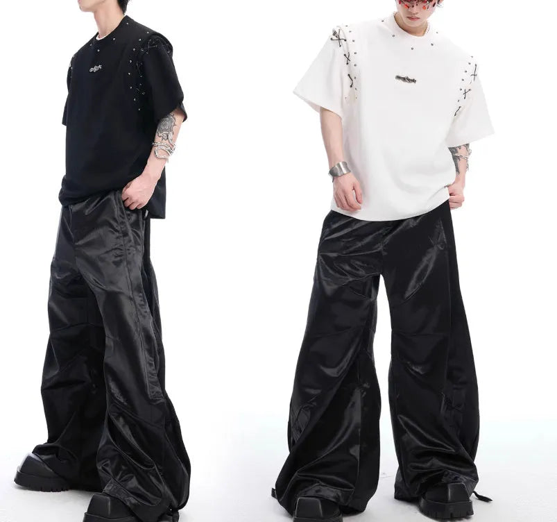 Black deconstructed lace-up short sleeve t-shirt with front cutout detail on a mannequin.