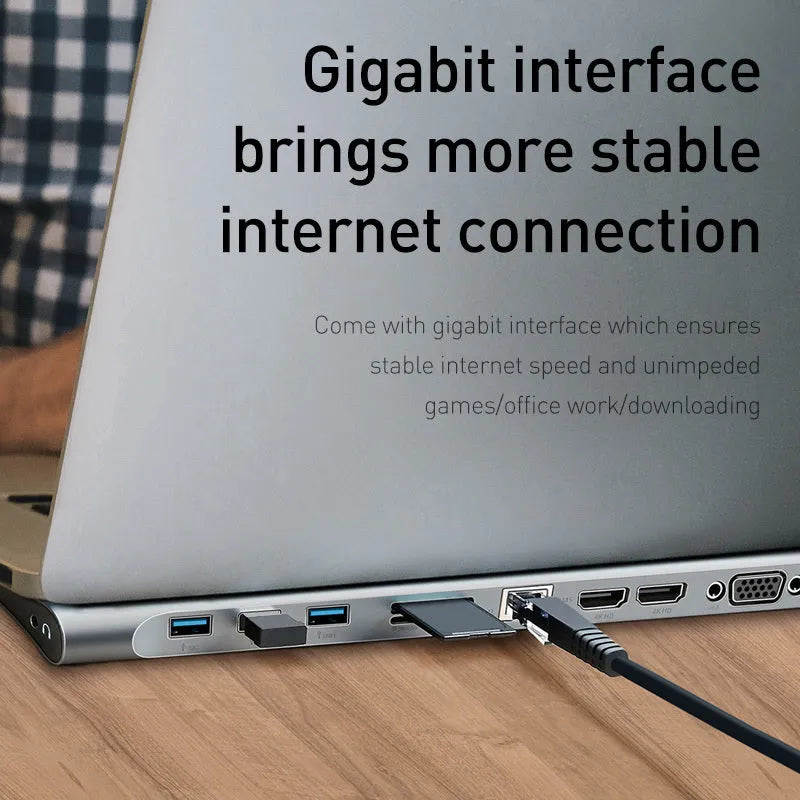Grey aluminium alloy USB C hub docking station with cooling bracket showing ten ports including HDMI and VGA