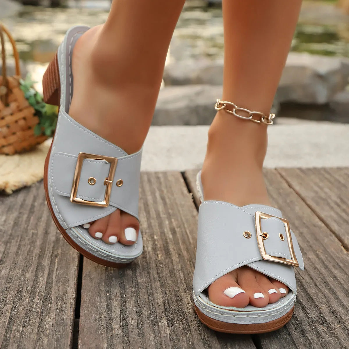 Women's black and light blue chunky heel sandals with a metal buckle and retro round-toe design.