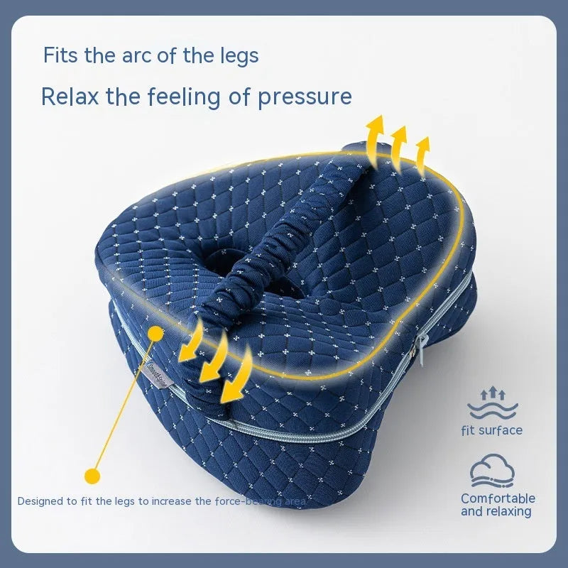 Heart-shaped dark blue jacquard memory foam leg pillow for adult knee and leg support.