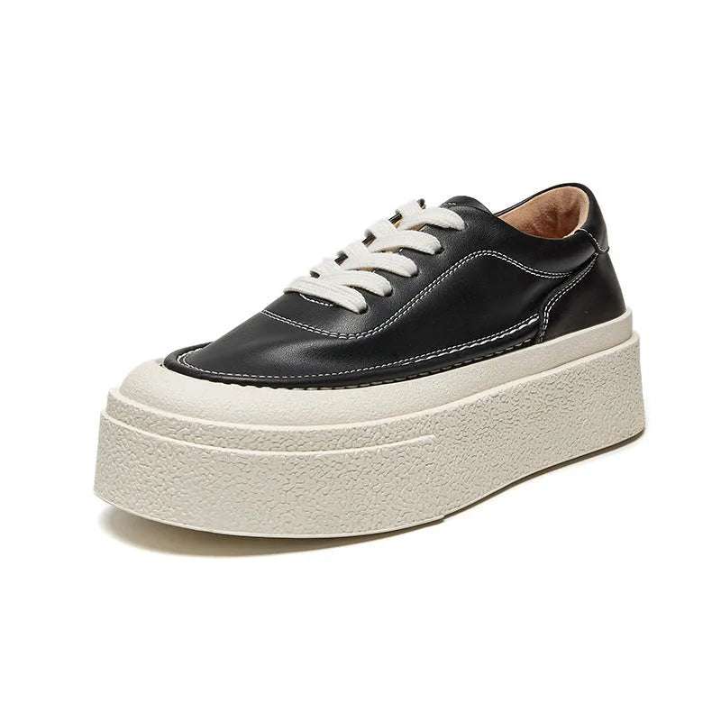 Women's black platform casual shoes with embossed cowhide texture and rubber sole