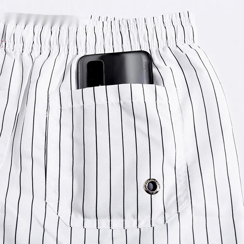 Men's white striped quick-drying loose plus-size beach pants with lining, waist elastic, and straight leg cut