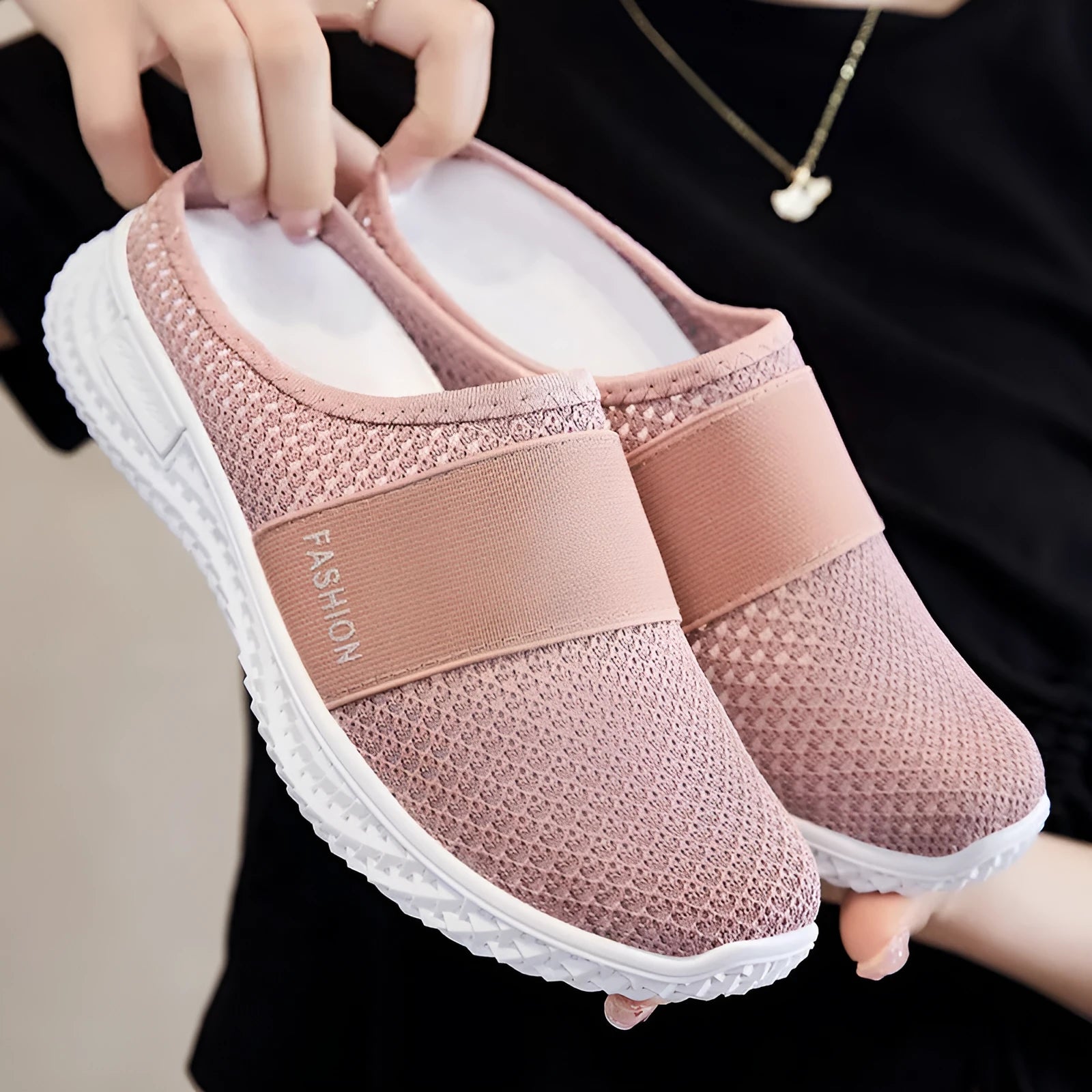Women's casual flat shoes with mesh upper and hollow-out design in black, grey, pink or purple.