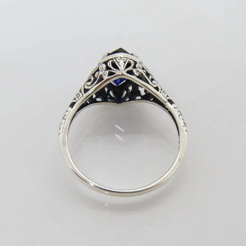 Women's silver alloy ring with geometric hollow pattern and zircon detailing