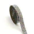 Close-up of a self-adhesive electroplated glass crystal strip on a roll for clothing decoration.