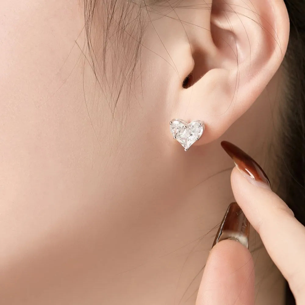 Pair of 925 sterling silver heart-shaped stud earrings with zircon detail and electroplated finish