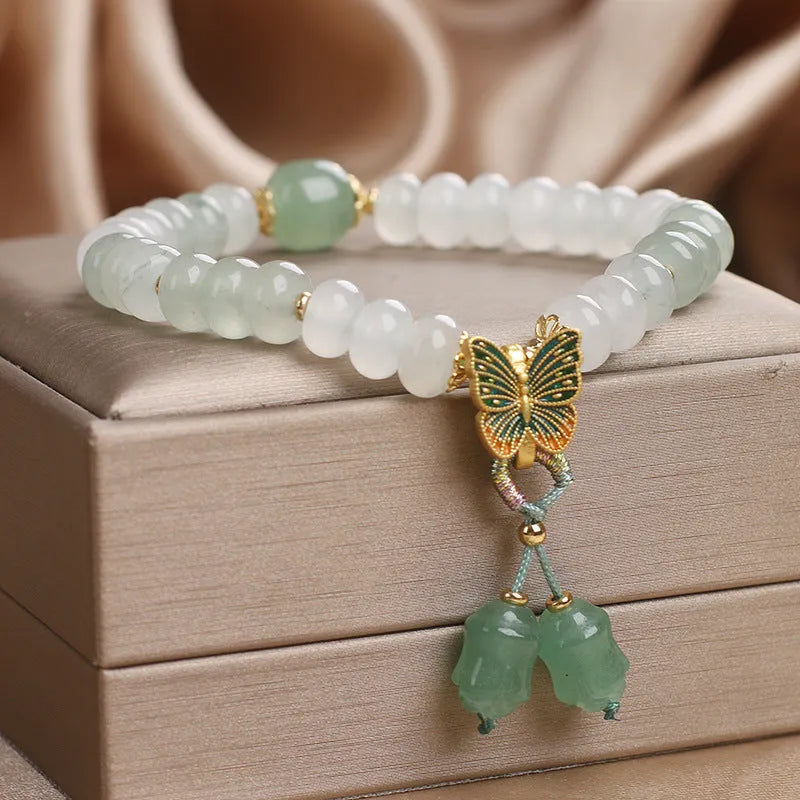 Green women's bracelet with Tian Shan Cui abacus beads and retro butterfly tassel design
