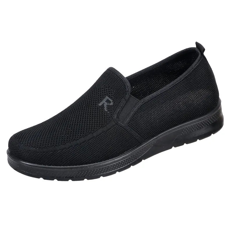 Men's black polyurethane slip-on shoes with breathable mesh upper and flat heel for casual wear