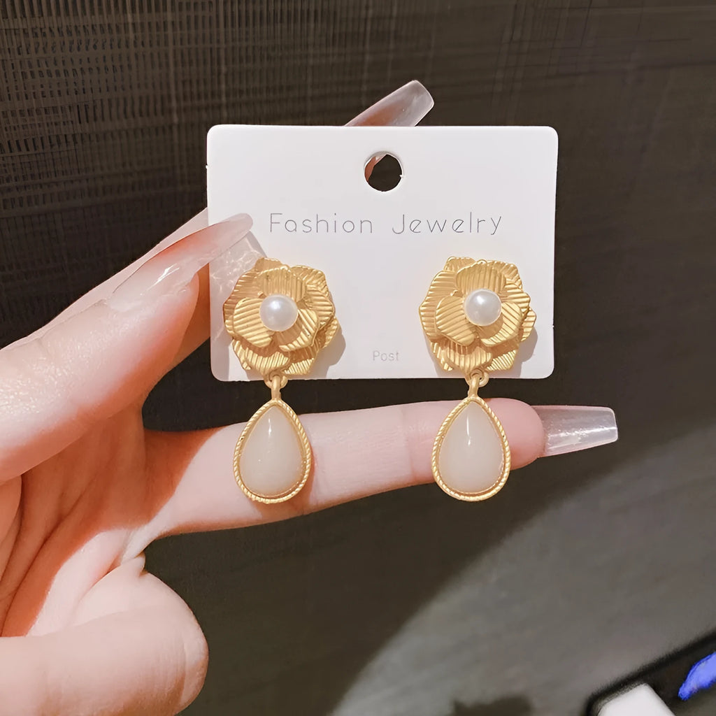Gold colour stud earrings with rose pearl design, opal stones, and ice flower elements
