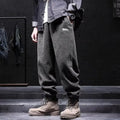 Men's grey casual sweatpants with ankle tie detail showing straight-leg silhouette