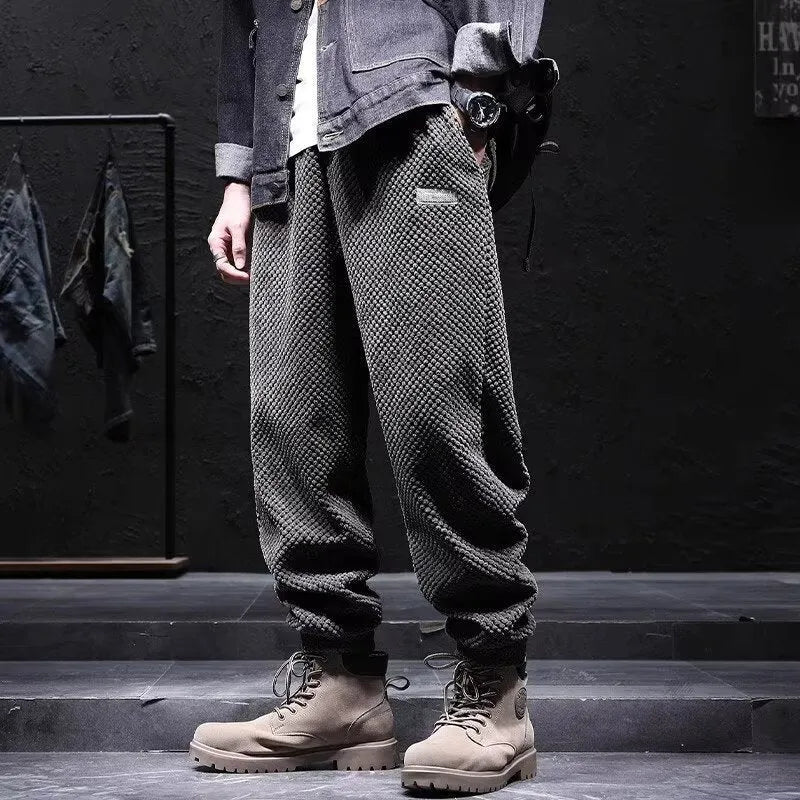 Men's grey casual sweatpants with ankle tie detail showing straight-leg silhouette