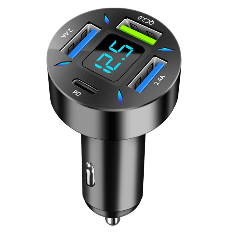 Four-port USB car charger with digital LED display plugged into a car dashboard